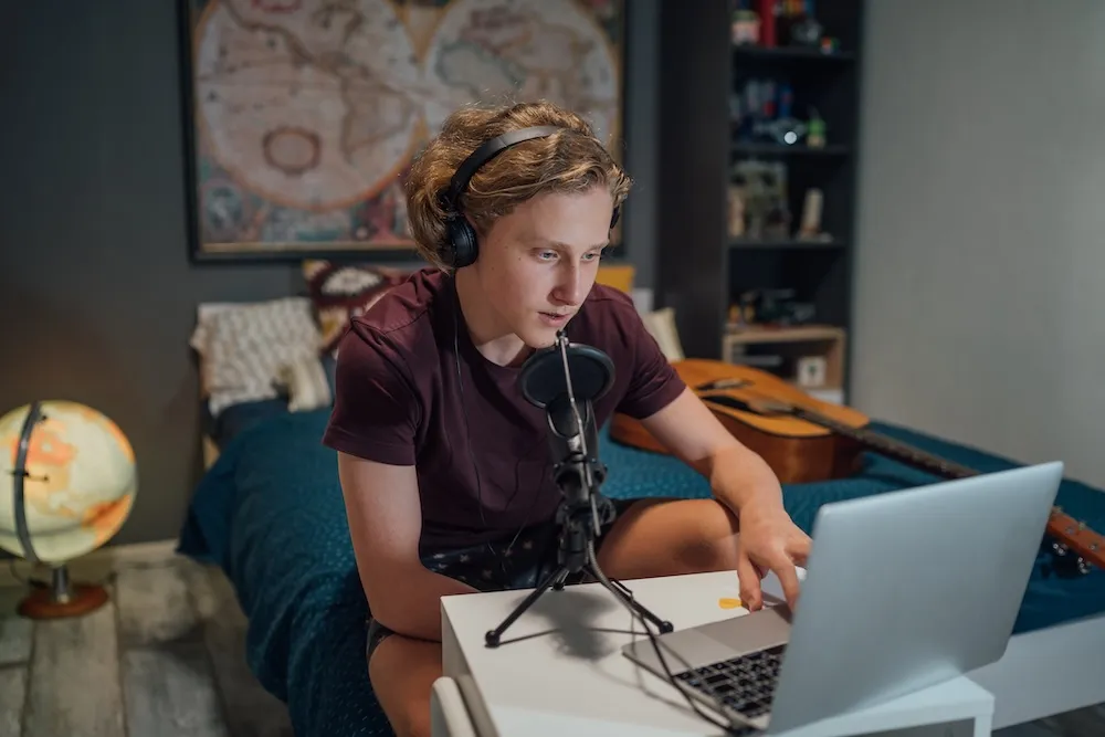 Person practising speaking with headphones and microphone for language shadowing